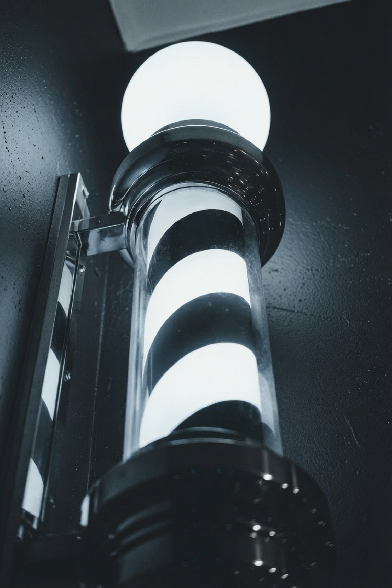 Classic barber pole at Obsidian Barbers near Washington Square