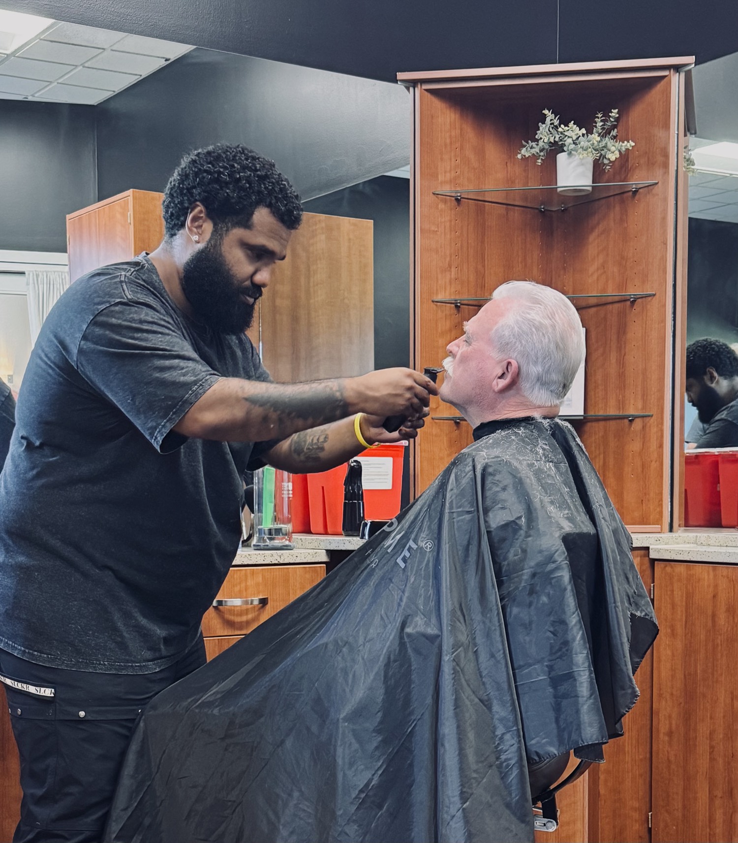 Shamel delivering a precision fade at Obsidian Barbers PDX